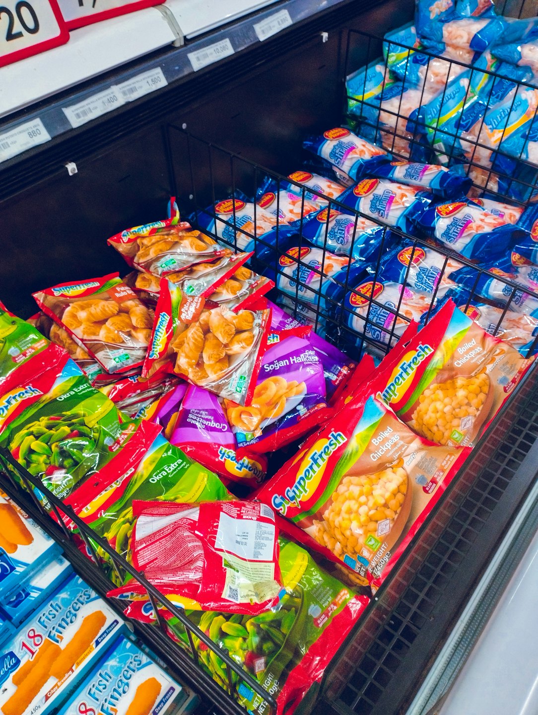 Frozen food products in supermarket freezer.